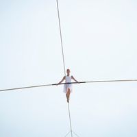 Tightrope Magic: Watch Her Climb!